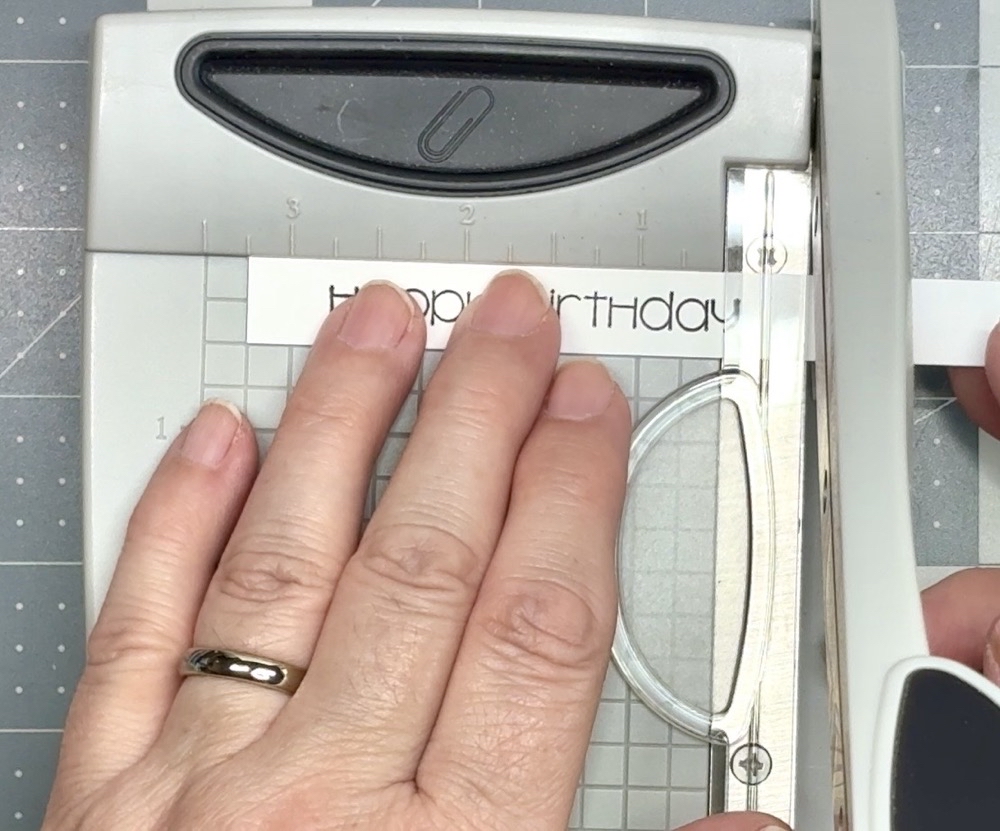 Screen shot showing trimming the ½” tall sentiment strip to 3 ¼” long.