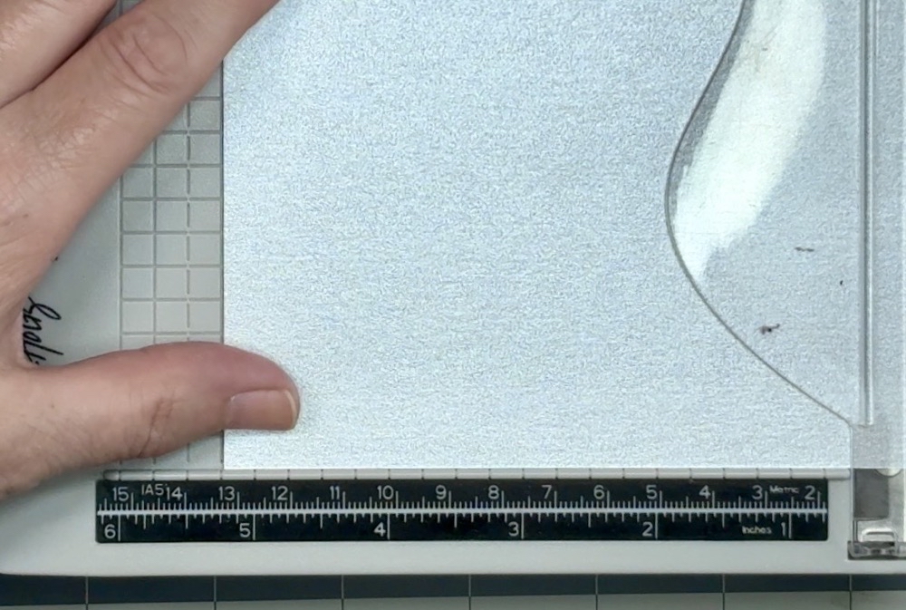 Screen shot of the brushed silver card stock used for the mat for today's card project being cut to 5 1/4โ tall.