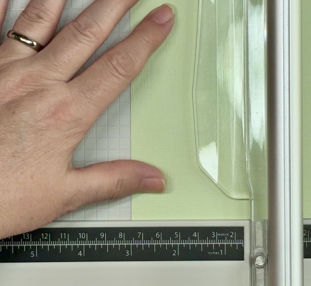 Screen shot showing the light green Bazzill Basics cardstock card mat being cut to 3” tall for today’s Make a Welcome Baby Card Two Ways project.