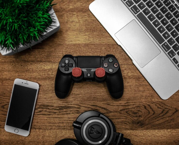 black game console on wooden surface