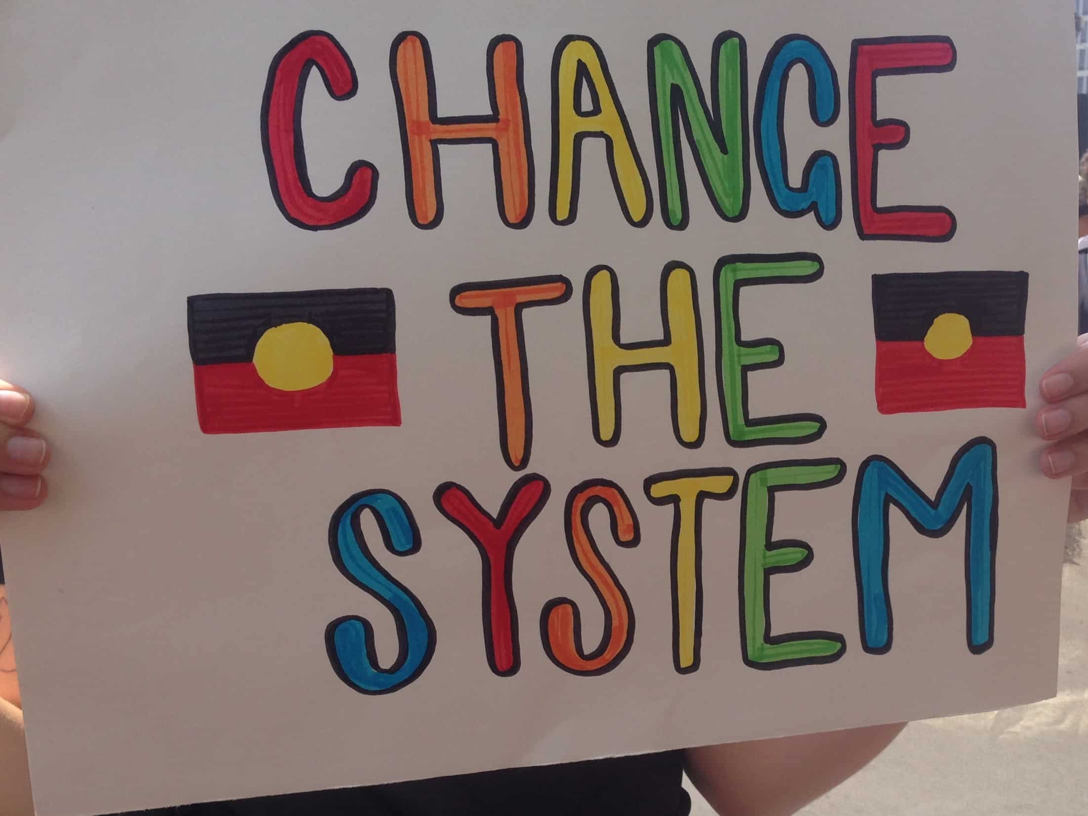 ||Image of a placard with handwritten text: "We can disagree and love eachother unless your disagreement is rooted in my oppresion and denial of my humanity and right to exist" Robert Jones