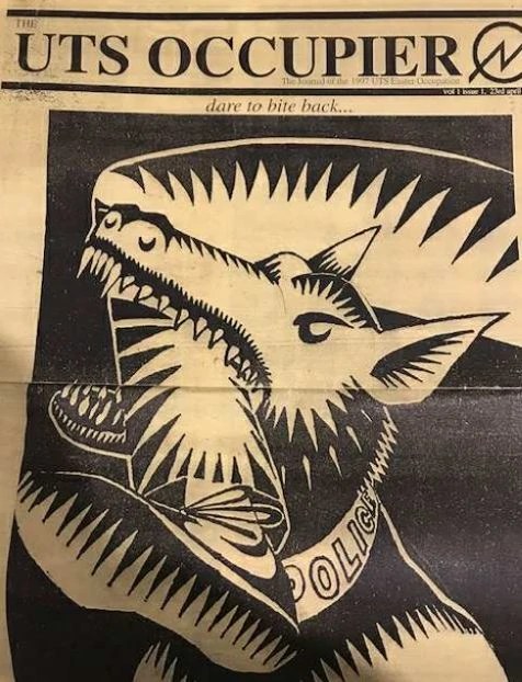 The cover of the magazine the UTS Occupier with a photo of a police dog biting a person's leg