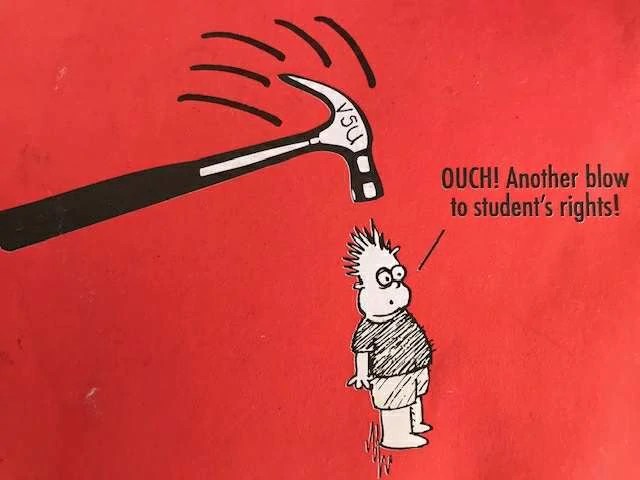 A hammer marked VSU swing down on a person's head. They are saying Ouch, another blow to student rights