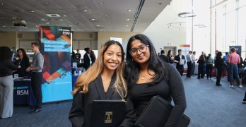 Two MIS Students posing at the IT Career Fair