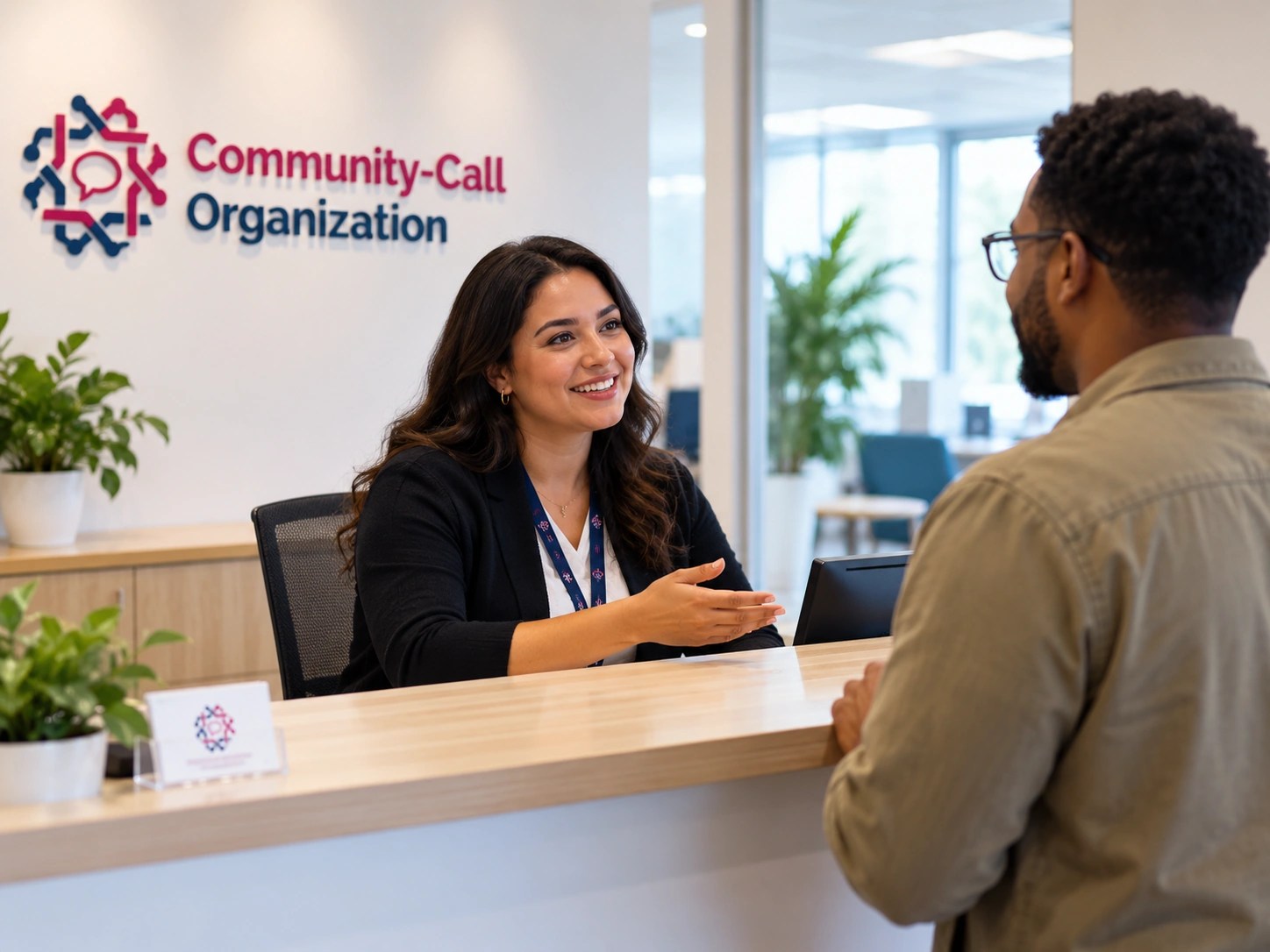 Community Support reception staff assisting visitor