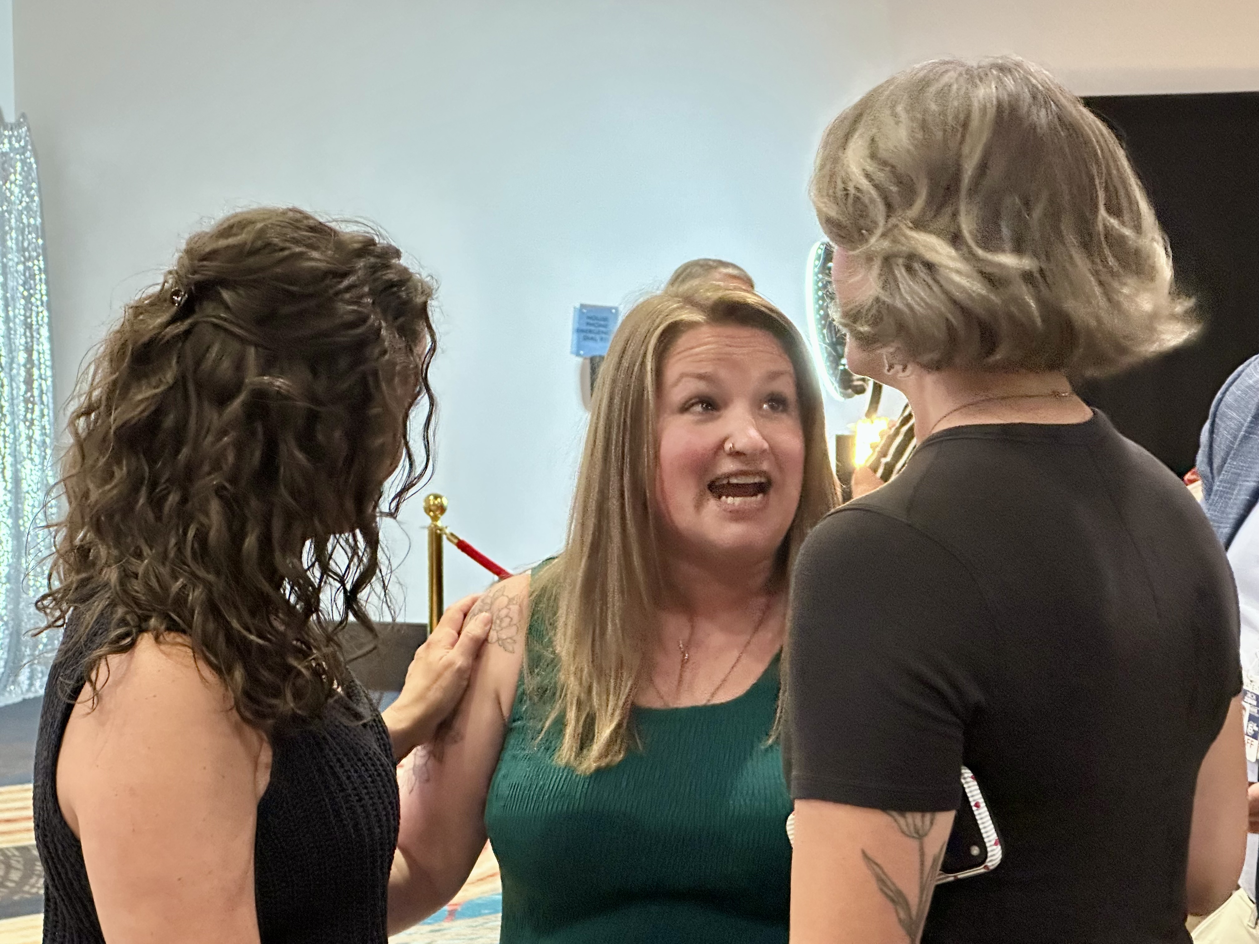 Knox County school board members Anne Templeton and Katherine Bike congratulate Brandy Jenkins.