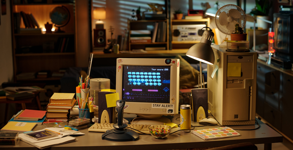 Dimly Lit Vintage Office Desk Lit by Lamp and Computer Screen