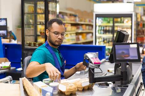 Retail cashier at checkout counter