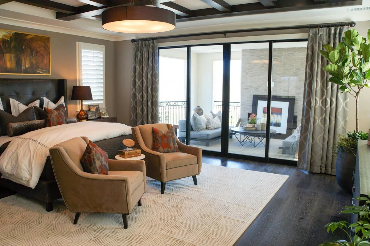 Elegant bedroom in Irvine, CA, featuring luxury decor and balcony access.