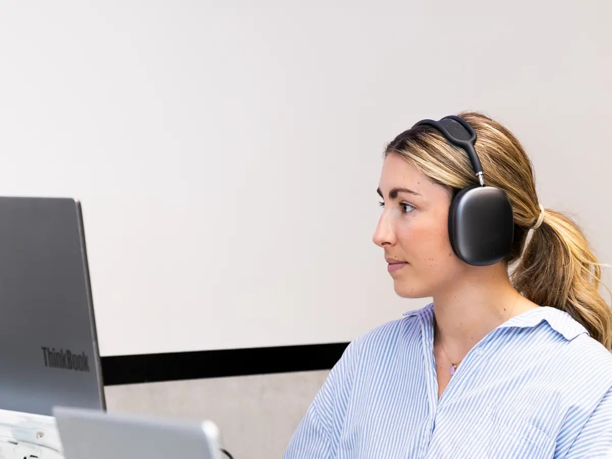 Connected Media Group team member working at a computer