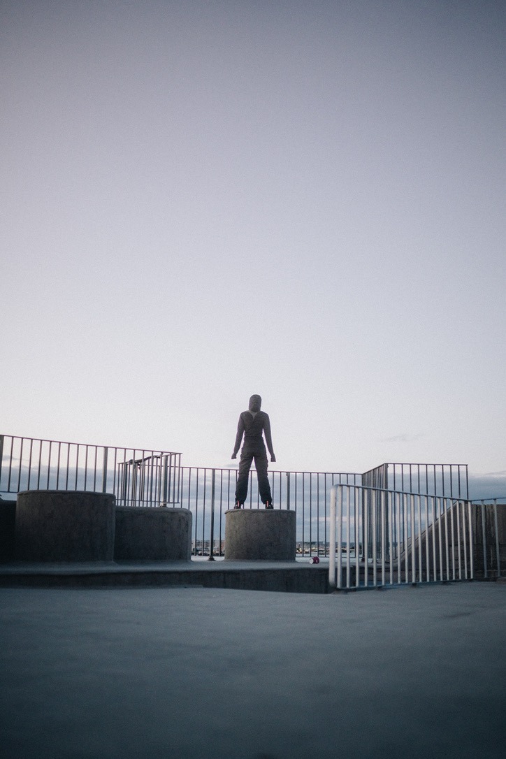 a woman had just completed her run, and stood looking at the sea on top of a podium shot with the tiffen promist 1/4