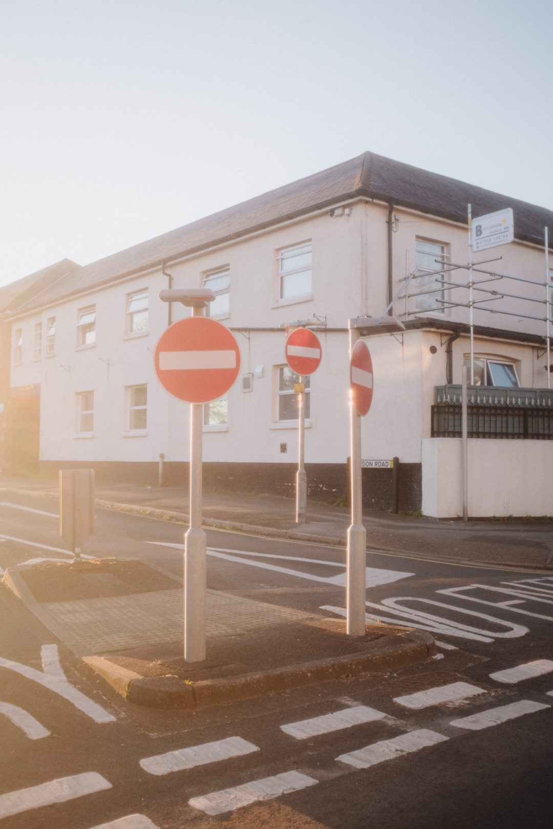 Using the homemade Promist filter at sunset, showing 3 stop signs