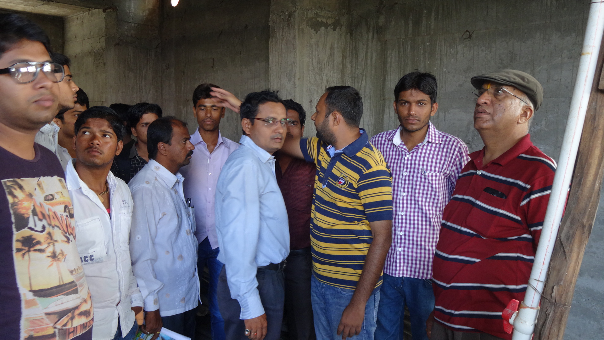 AUTHOR with Construction personnel at a site