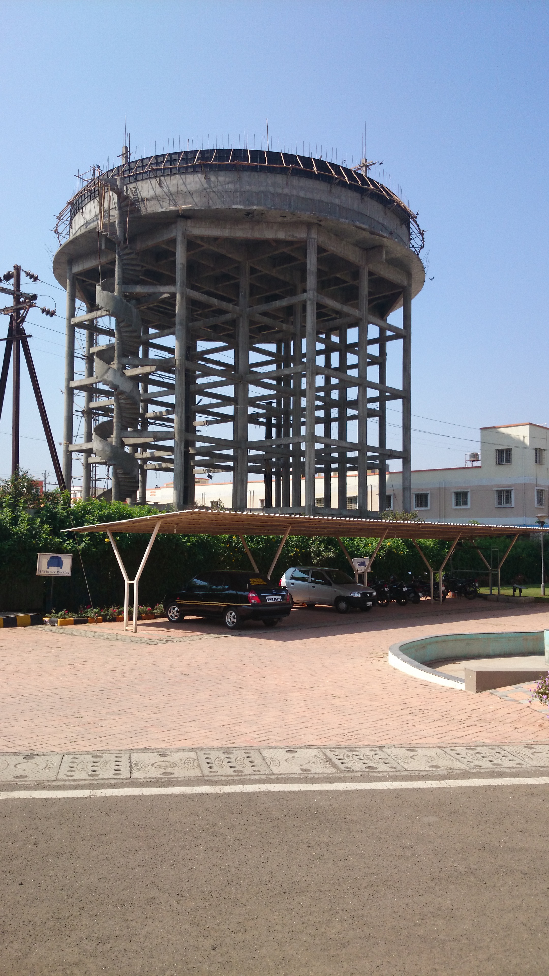 OBSERVE THE GRID OF BEAMS IN THE STAGING OF THIS HUGE OVERHEAD WATER TANK.