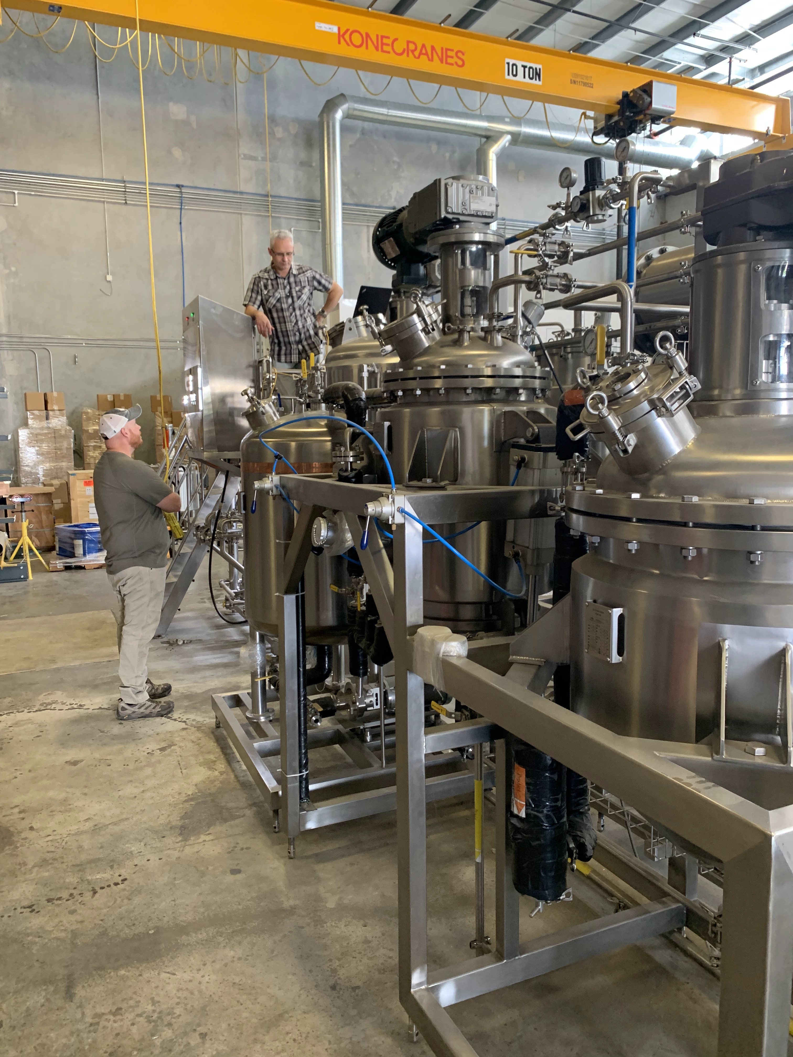 Stainless process vessels being assembled in a production facility