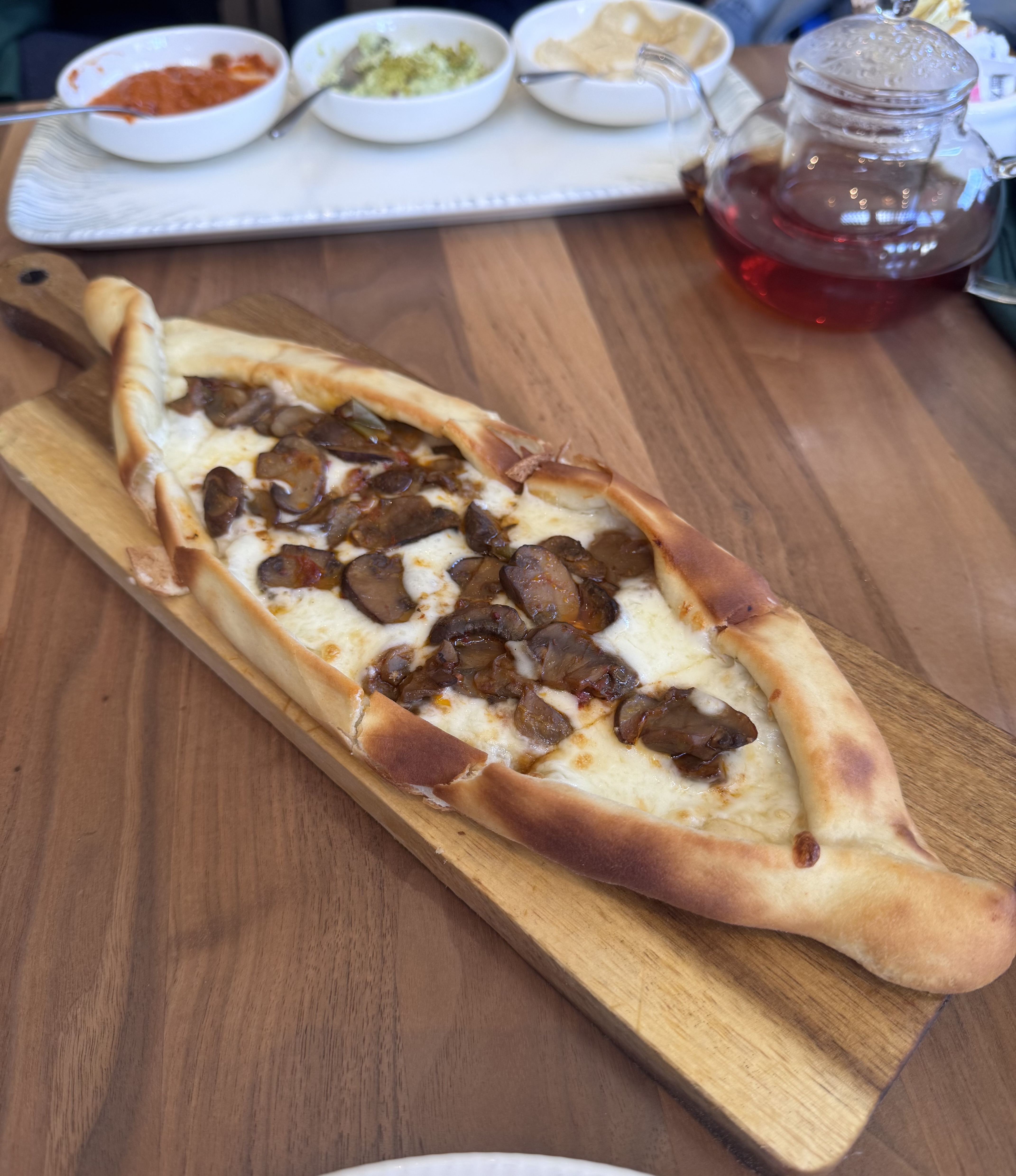 Mushroom pide with mushrooms, red pepper, onion, and kasseri cheese at Divan in Berkeley