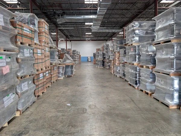 Forklift unloading floor-loaded freight for container devanning in Jacksonville