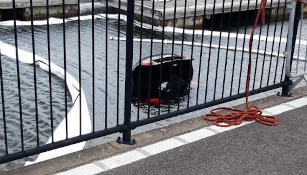 Bmw m4 ends up underwater after crashing into marina