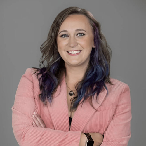 a professional woman smiling with a plain background