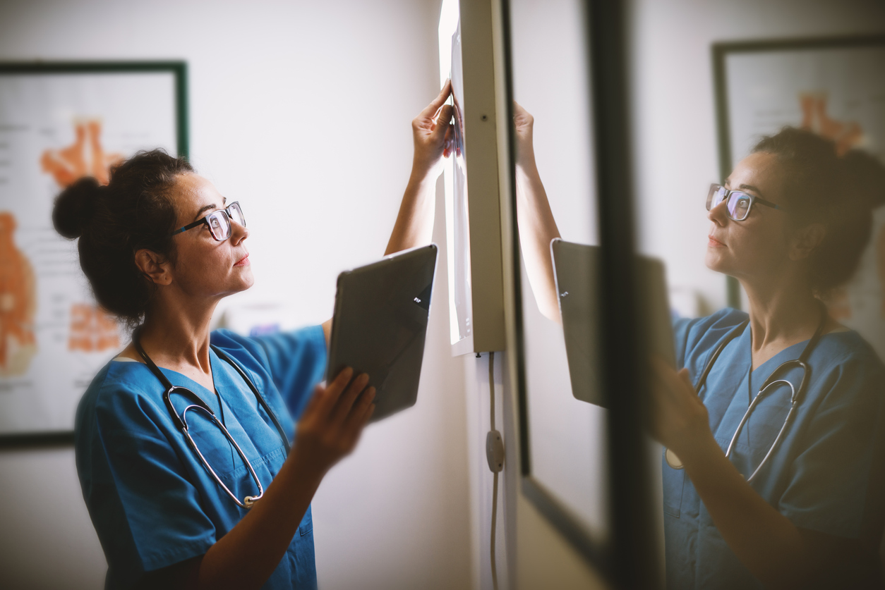 content strategy for pharma: stop using redundant content and focus on research | content rules | woman in scrubs at a board
