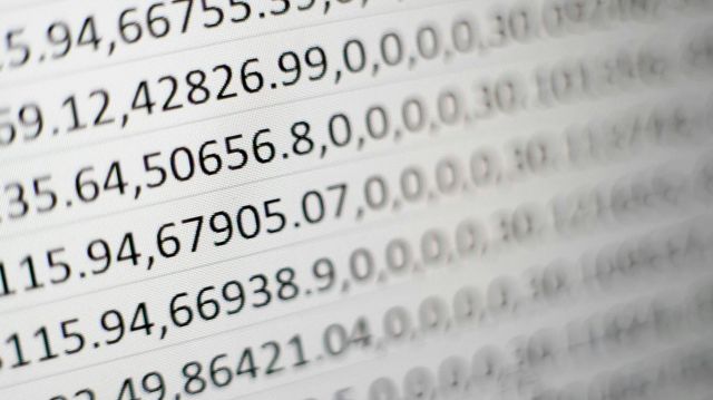 Technician reviewing digital logs for biosafety containment