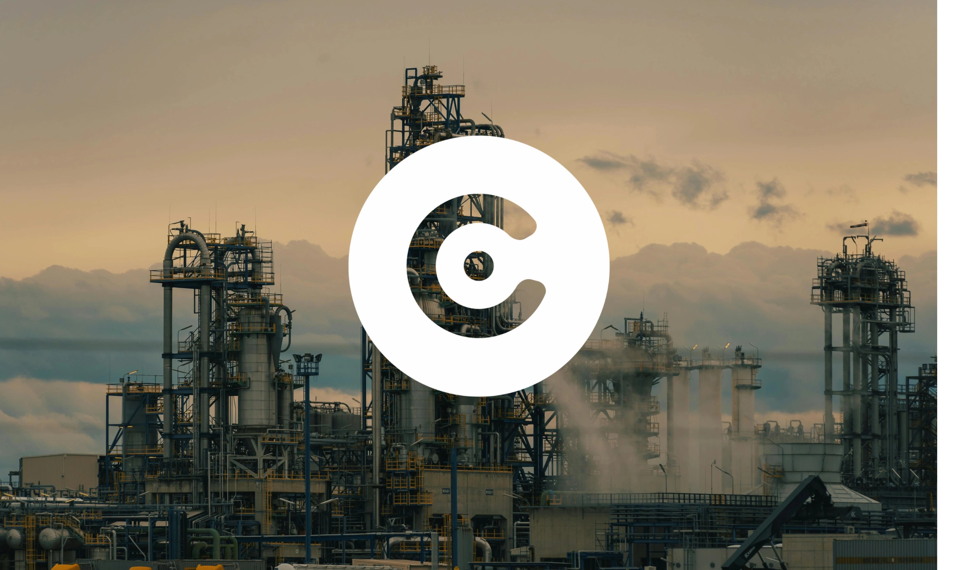 Industrial plant with metal structures and pipes emitting steam under a cloudy sky, overlaid with a large white circular logo.
