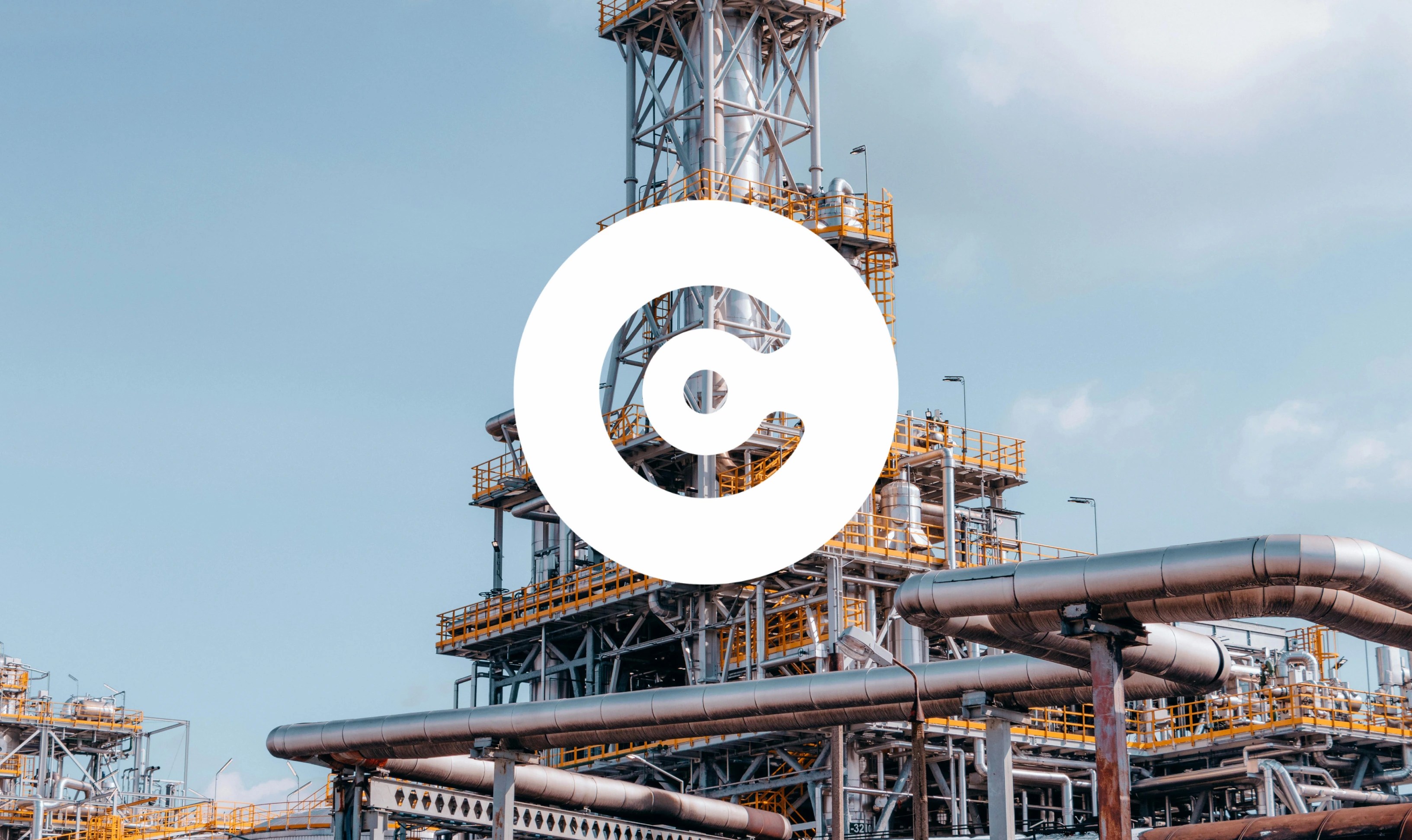 Industrial refinery structure with metal pipes and platforms, overlaid with a large white circular logo in the center.