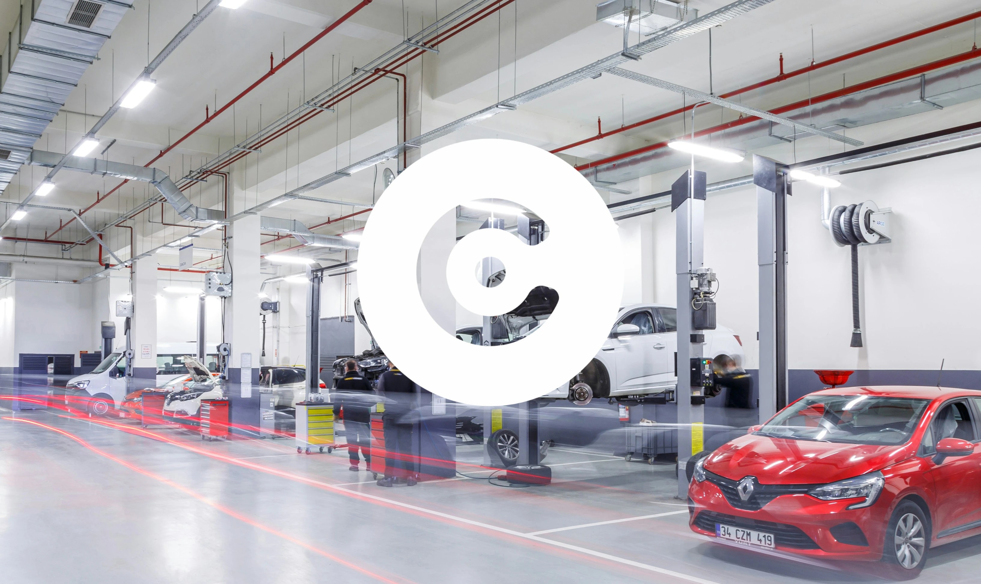 Bright, modern car service workshop with multiple vehicles on hydraulic lifts, mechanics working, and a red car parked in the foreground.
