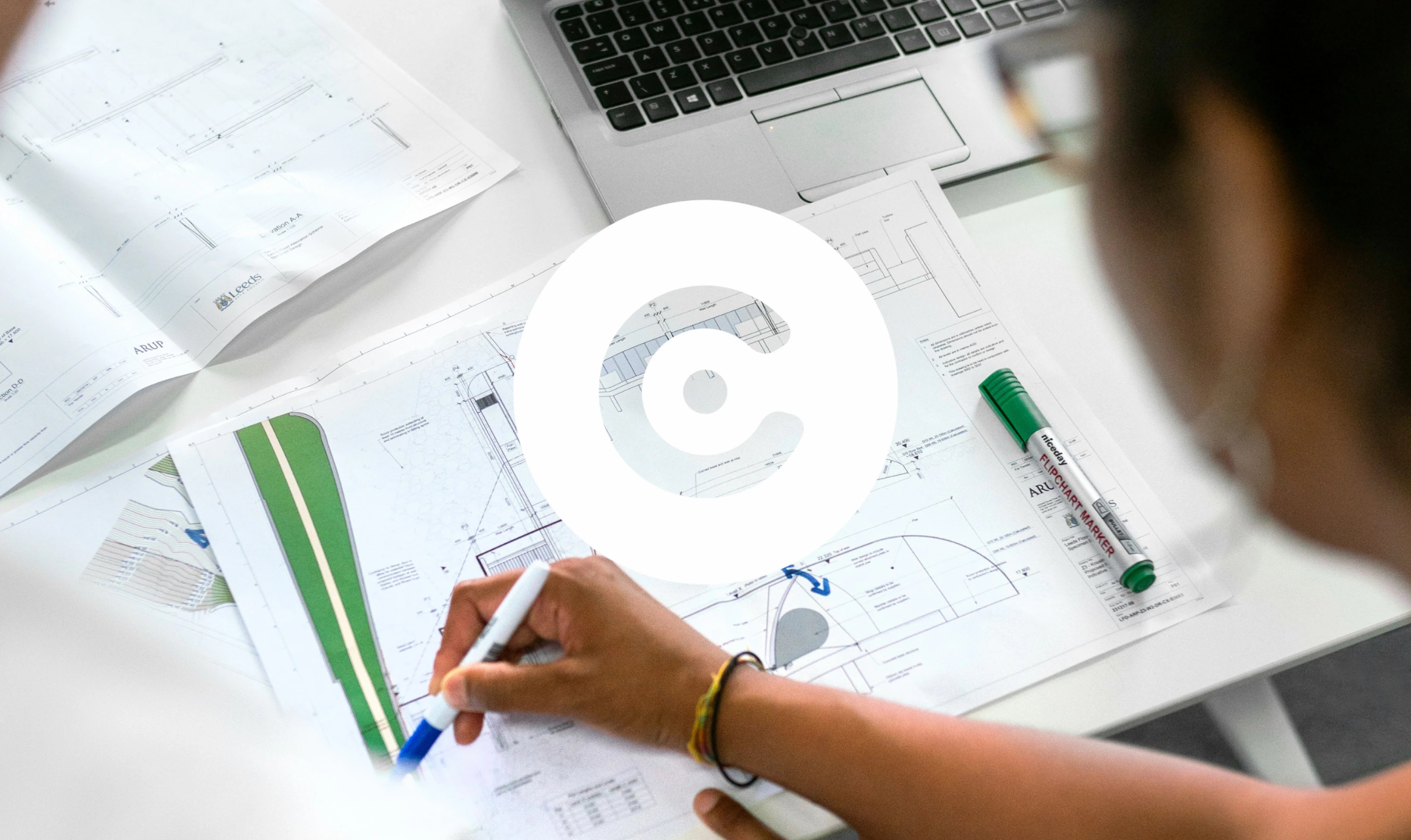 Engineer reviews a technical drawing.
