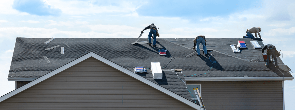Roofing and gutter installation crew at work