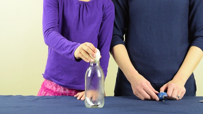 Place a straw into the bottle, but do not . Egg In A Bottle Science Experiment
