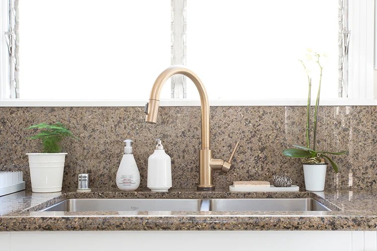 Decluttering and organizing the kitchen sink area and cabinets with copycatchic and @methodhome minimalist home luxe living for less