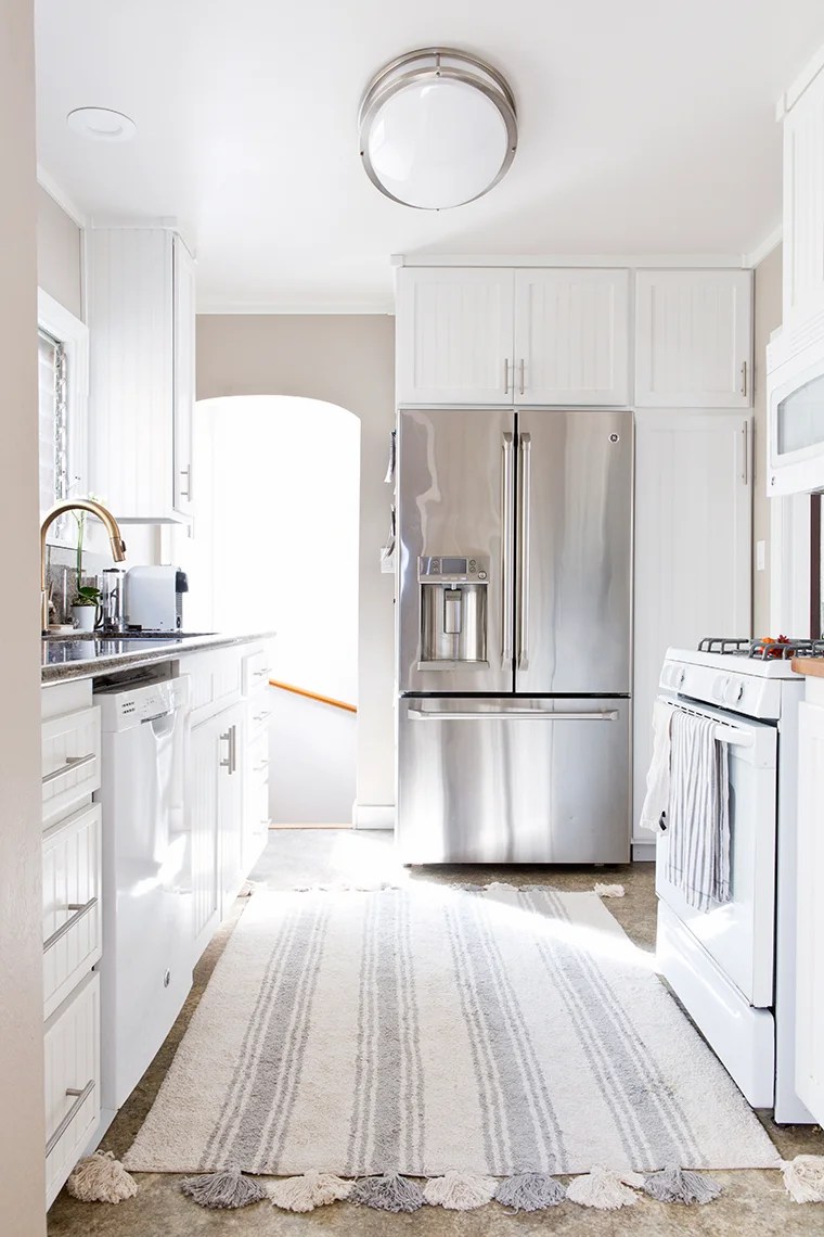 Decluttering and organizing the kitchen sink area and cabinets with copycatchic and @methodhome minimalist home luxe living for less