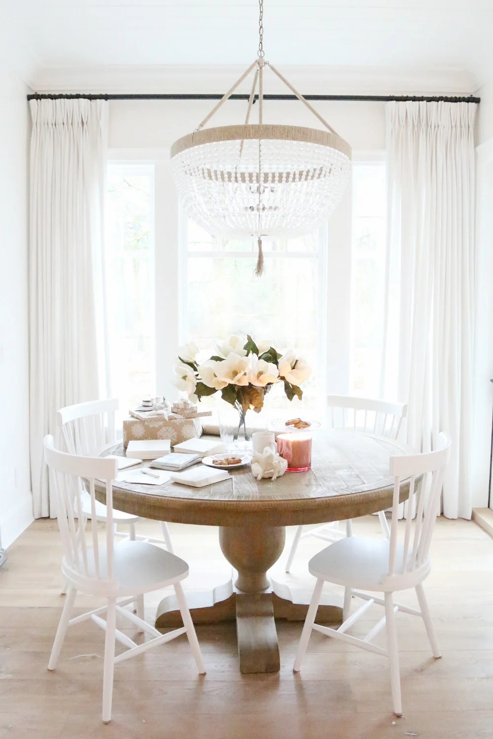 Restoration Hardware French Urn Pedestal Round Dining Table for $1393 vs World Market Round Blanca Table $400 copycatchic luxe living for less home decor