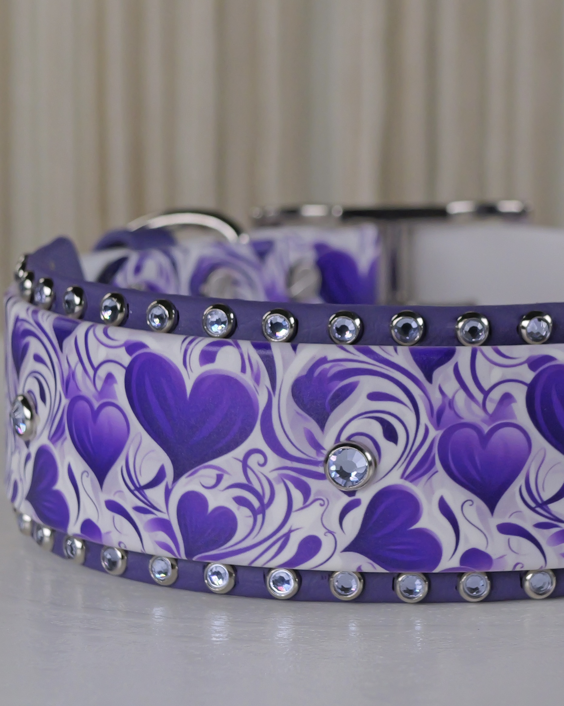 Close up - rhinestone 2 inch biothane dog collar with UV printed purple hearts artwork