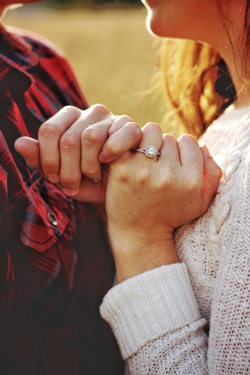 man and woman holding hands