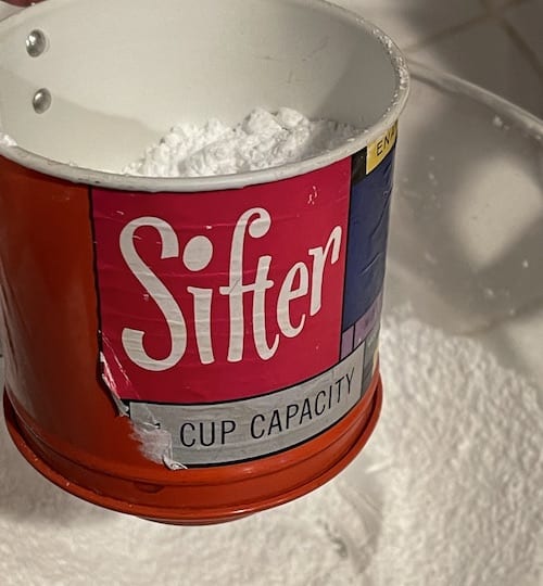 sift powdered sugar