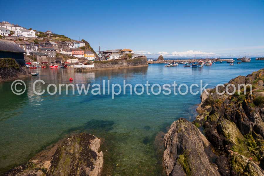 Mevagissey Harbour With Rocks In Foreground