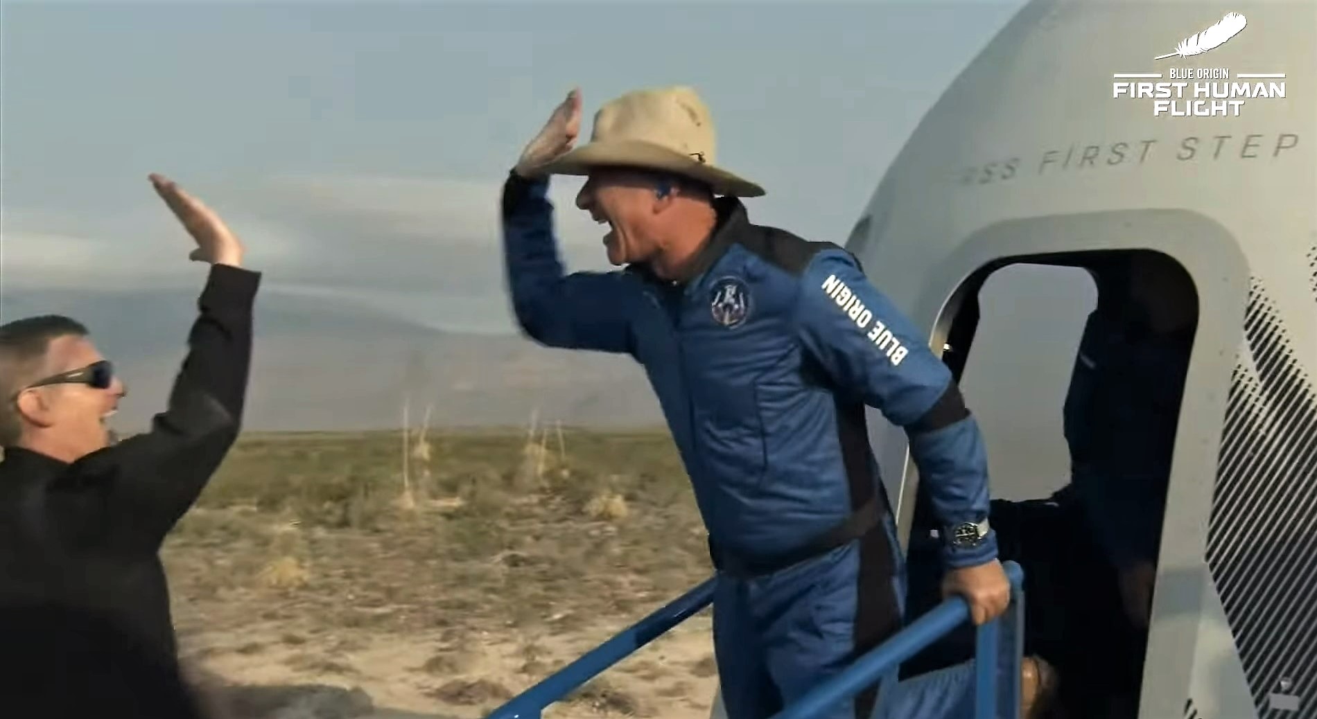 Jeff Bezos gives high-five