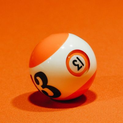 billiard ball on bright orange surface