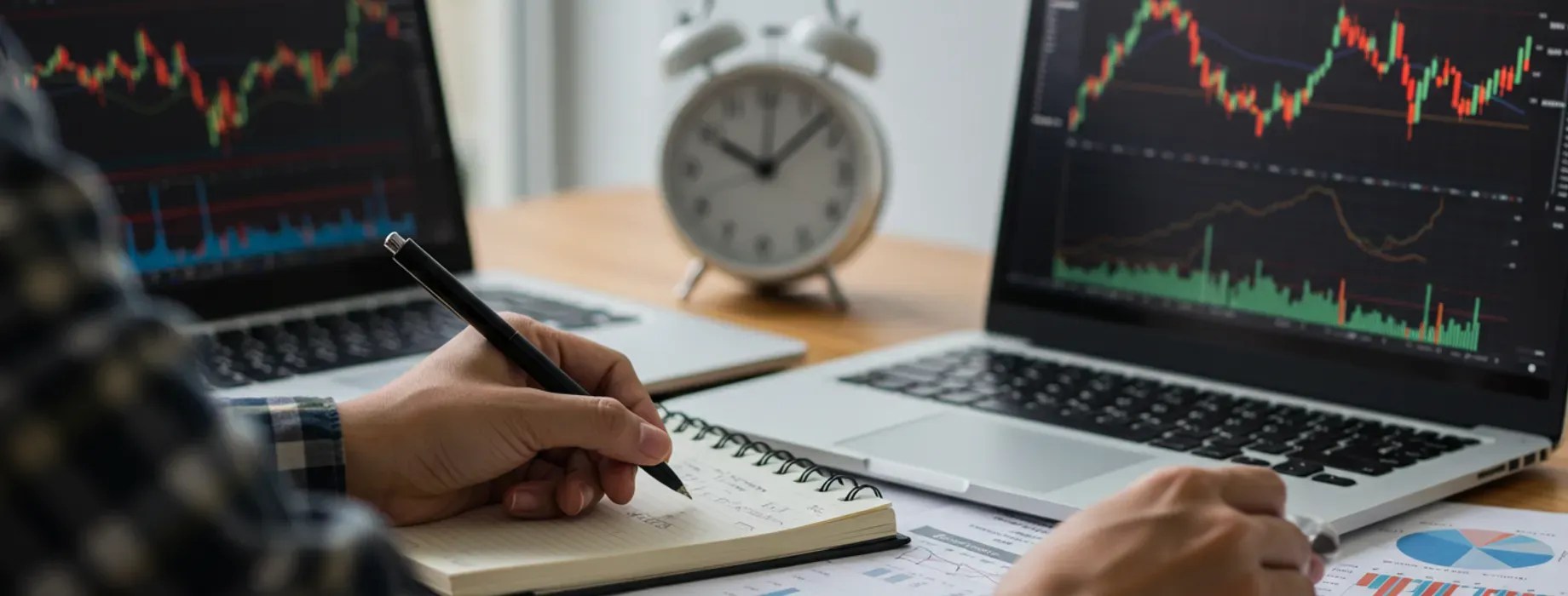 beginner learning crypto trading by studying charts and taking notes