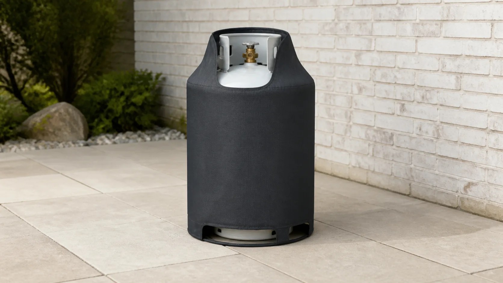 Ventilated charcoal fitted cover around one upright outdoor propane cylinder beside a masonry wall