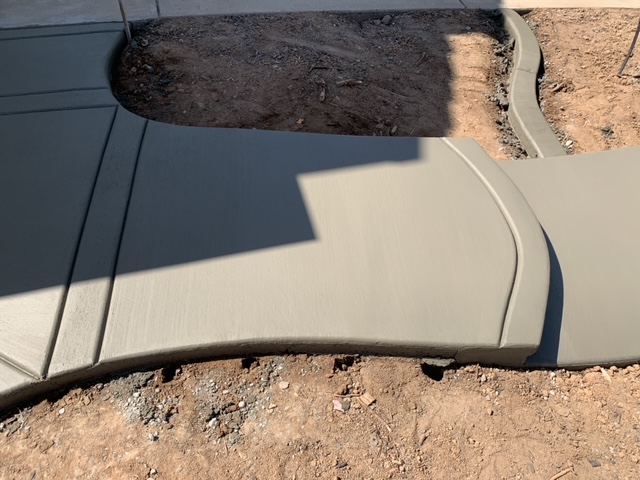 Residential concrete sidewalk with a broom finish