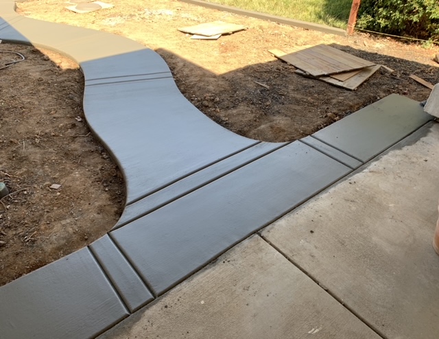 Residential concrete sidewalk with a broom finish
