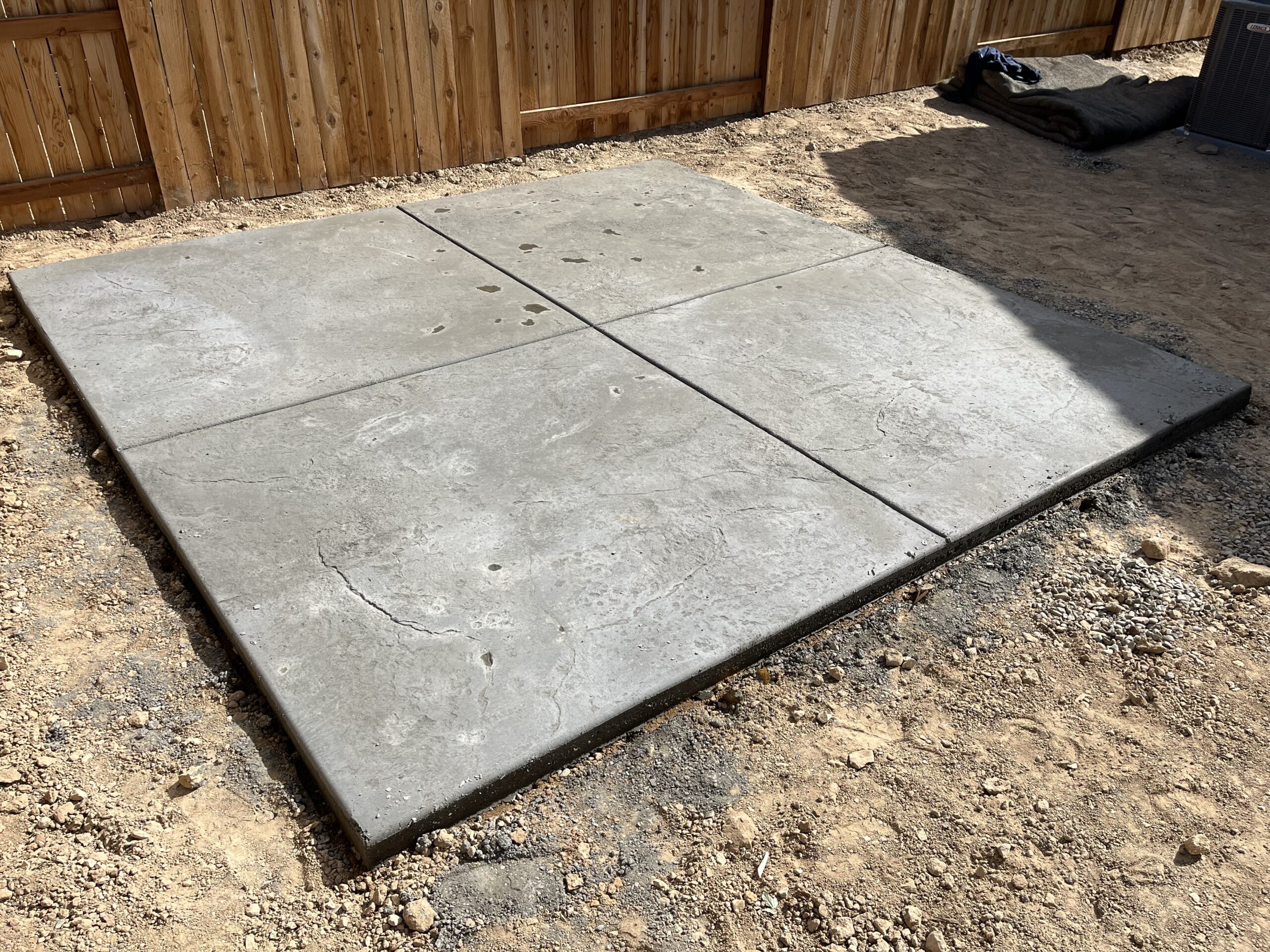 Finished concrete patio in residential backyard