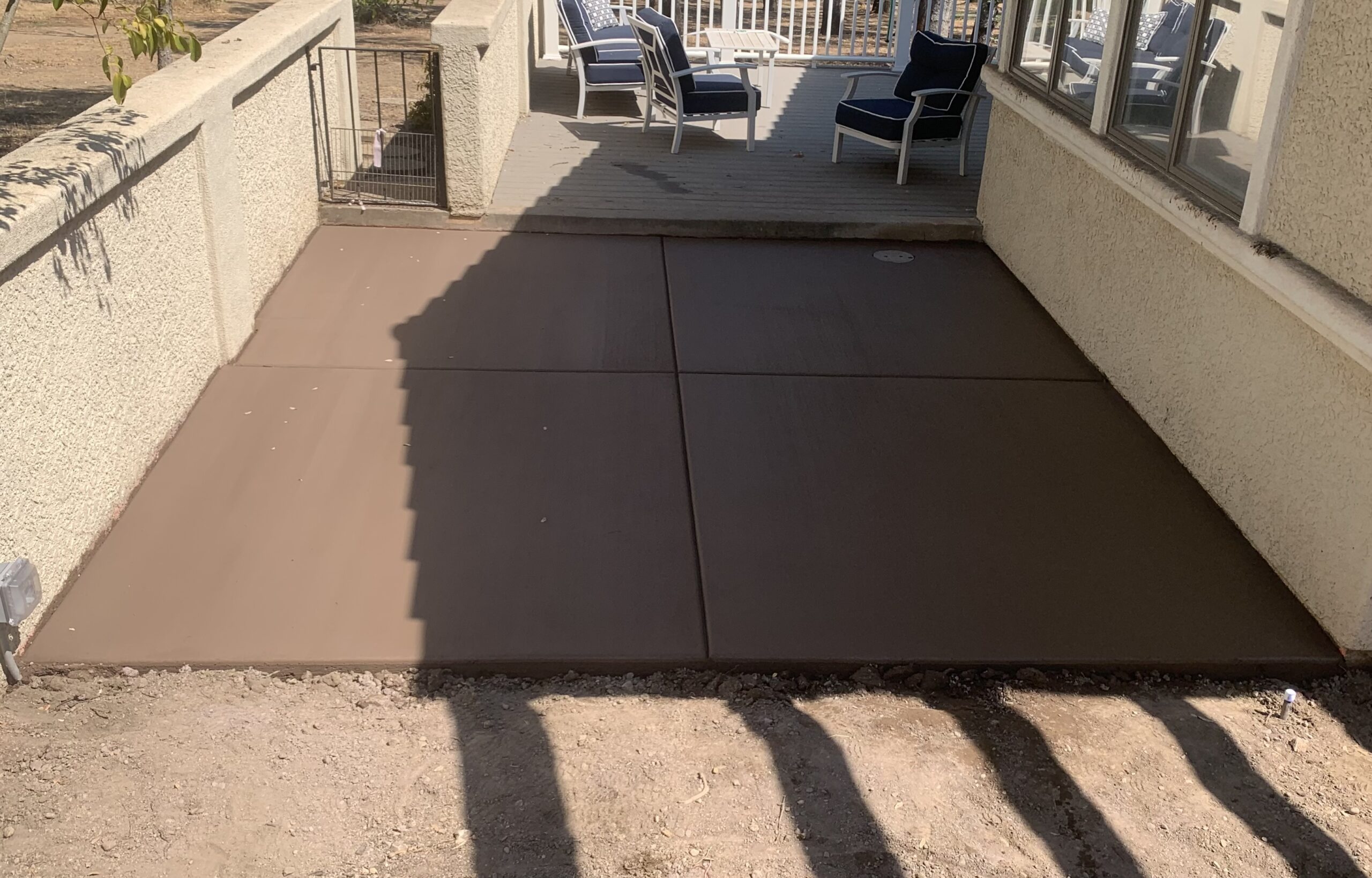 Finished concrete patio in residential backyard