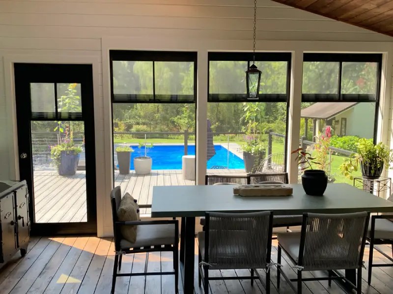poolside dining view with Craft-Bilt stacking windows