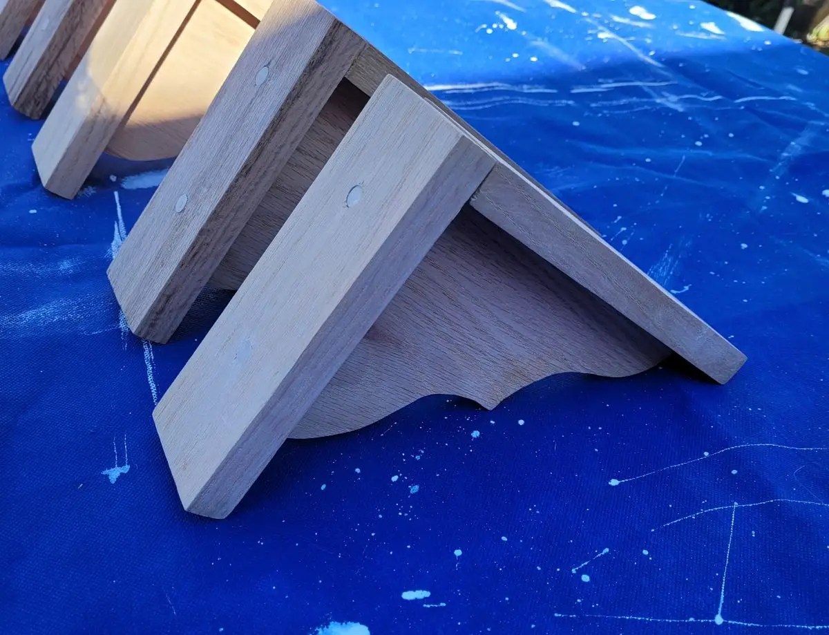 Upside down view of unfinished oak shelf brackets for kitchen