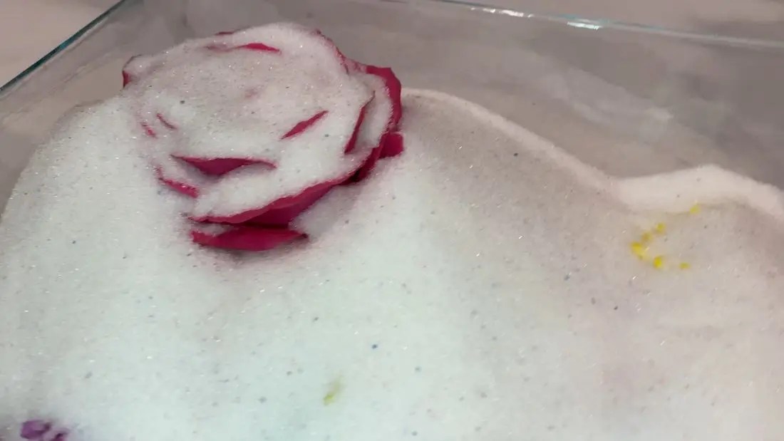 Gently covering flowers with silica gel