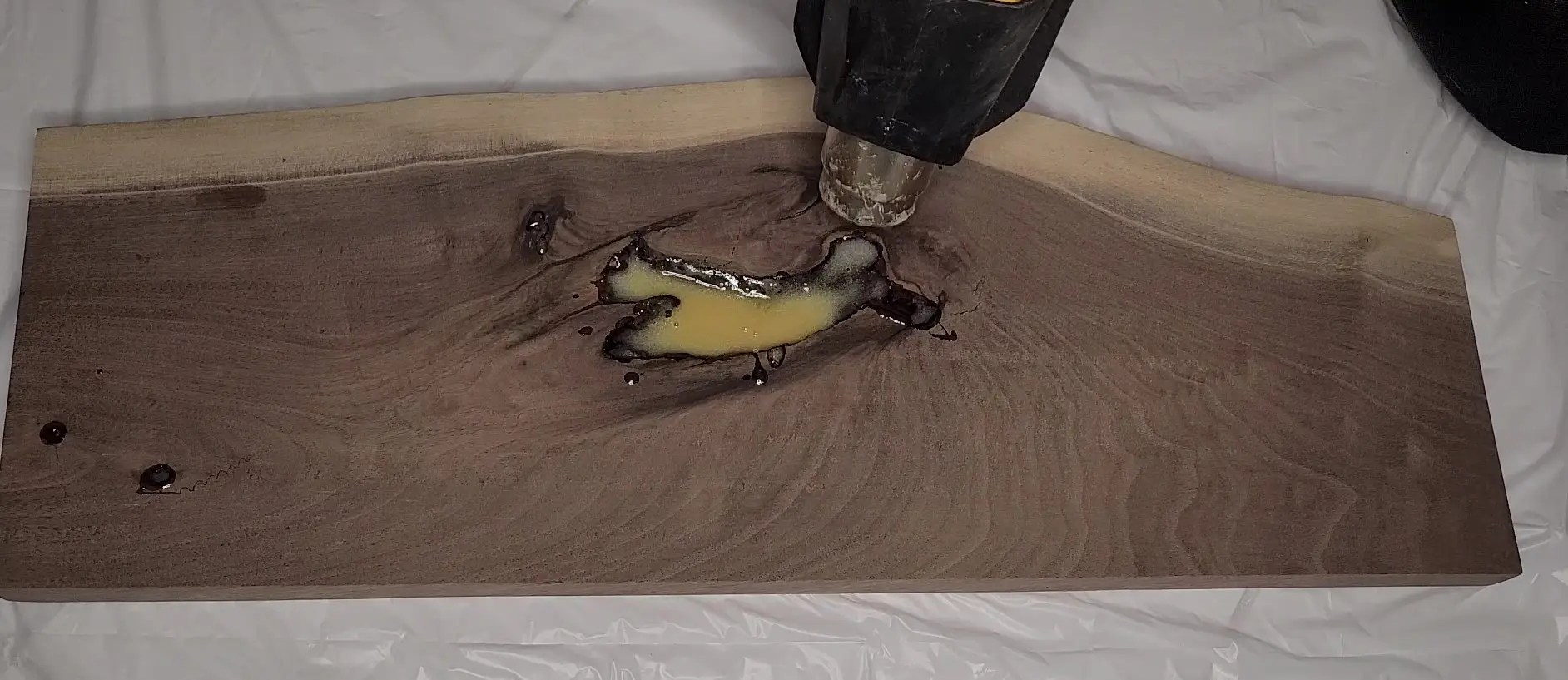 Live edge walnut shelf with bad yellow epoxy